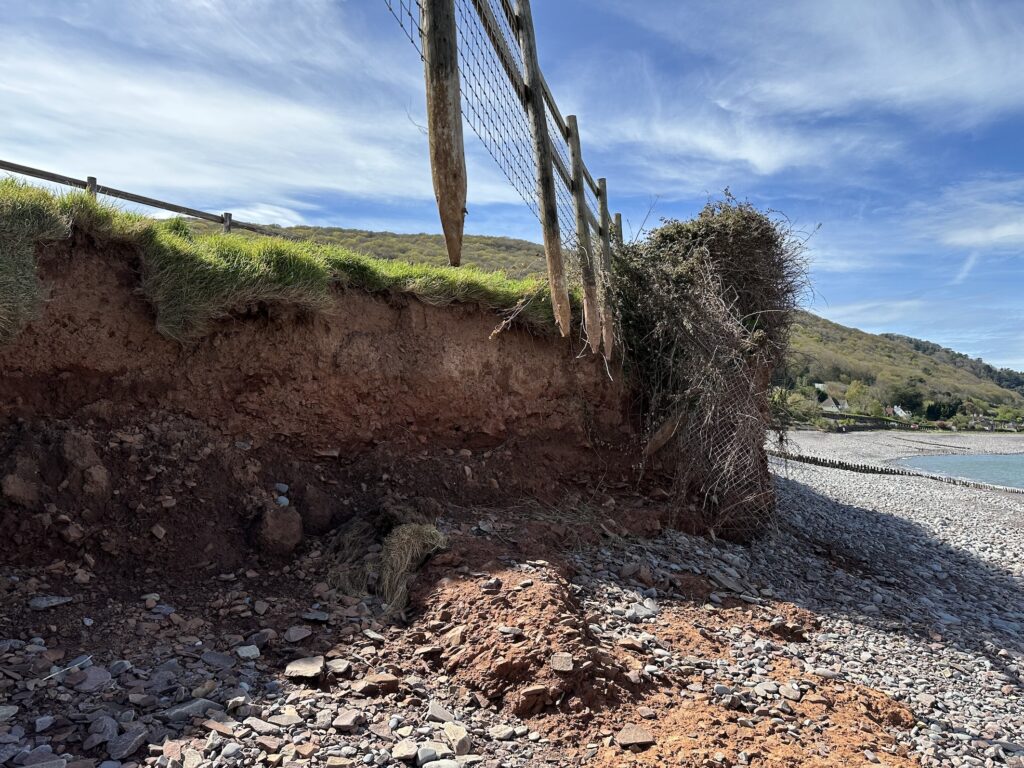 Fence hanging in the wind at Porlock Weir